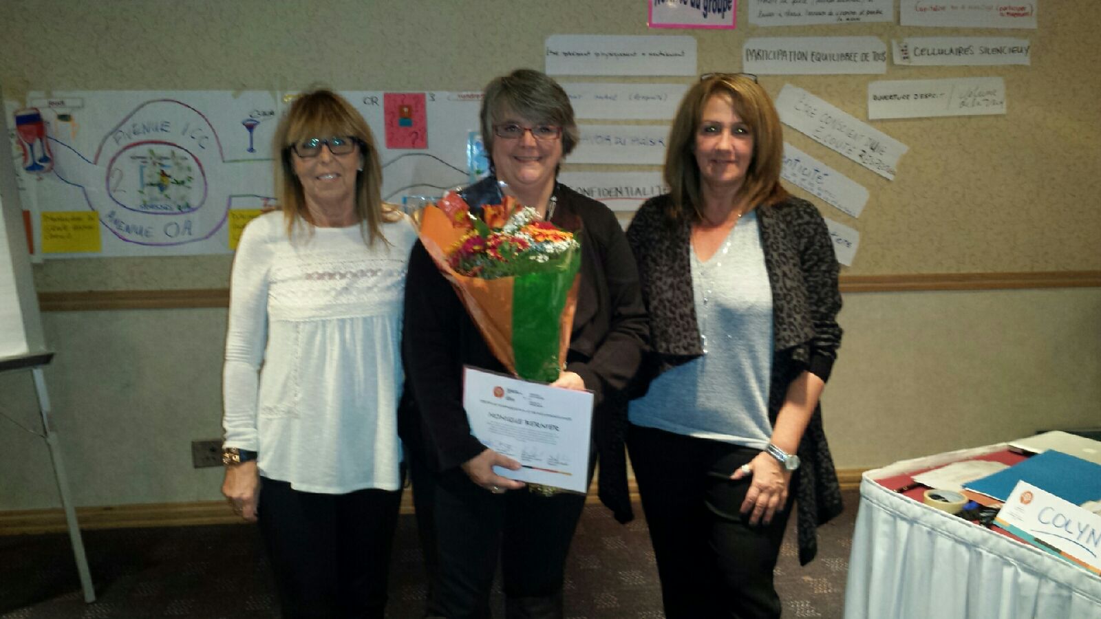 Carolle Lajoie (left) and Manon Bouchard (right) took the opportunity to recognize Monique Bernier’s retirement from the Public Service