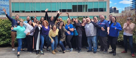 An enthusiastic group poses for the camera