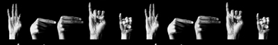 Hands fingerspelling against a black background